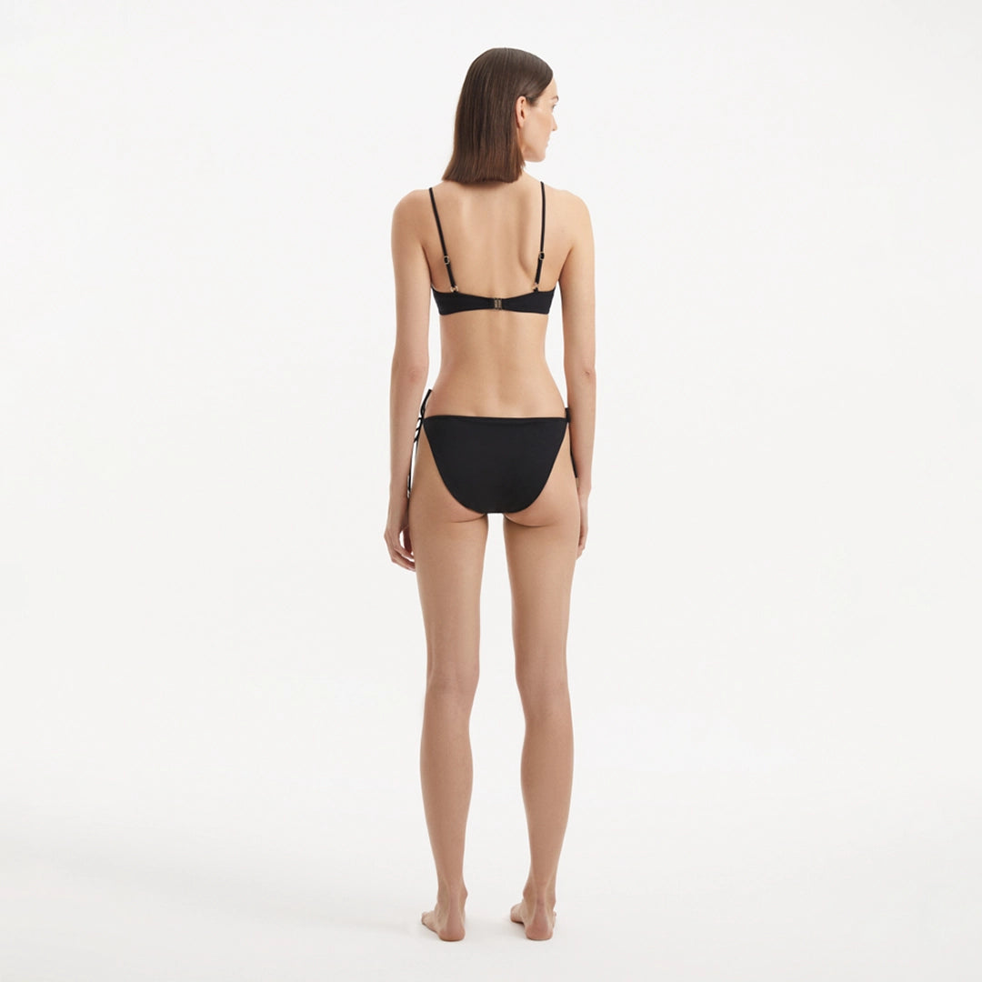 Salila Black Underwired Side Tie Wave Textured Bikini Set | Moeva | | Each week unveils new pieces—luxury swimwear, fluid resort silhouettes, and elevated summer-to-evening essentials designed to carry you from coastal escapes to city nights.