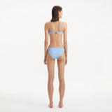 Salila Baby Blue Underwired Side Tie Wave Textured Bikini Set | Moeva | | Each week unveils new pieces—luxury swimwear, fluid resort silhouettes, and elevated summer-to-evening essentials designed to carry you from coastal escapes to city nights.