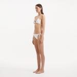 Sarita White Triangle Wave Textured Side Tie Bikini Set | Moeva | | Each week unveils new pieces—luxury swimwear, fluid resort silhouettes, and elevated summer-to-evening essentials designed to carry you from coastal escapes to city nights.