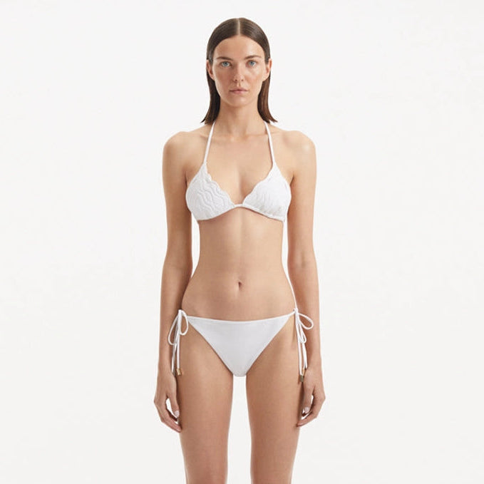 Sarita White Triangle Wave Textured Side Tie Bikini Set | Moeva | Bikini Set | Each week unveils new pieces—luxury swimwear, fluid resort silhouettes, and elevated summer-to-evening essentials designed to carry you from coastal escapes to city nights.