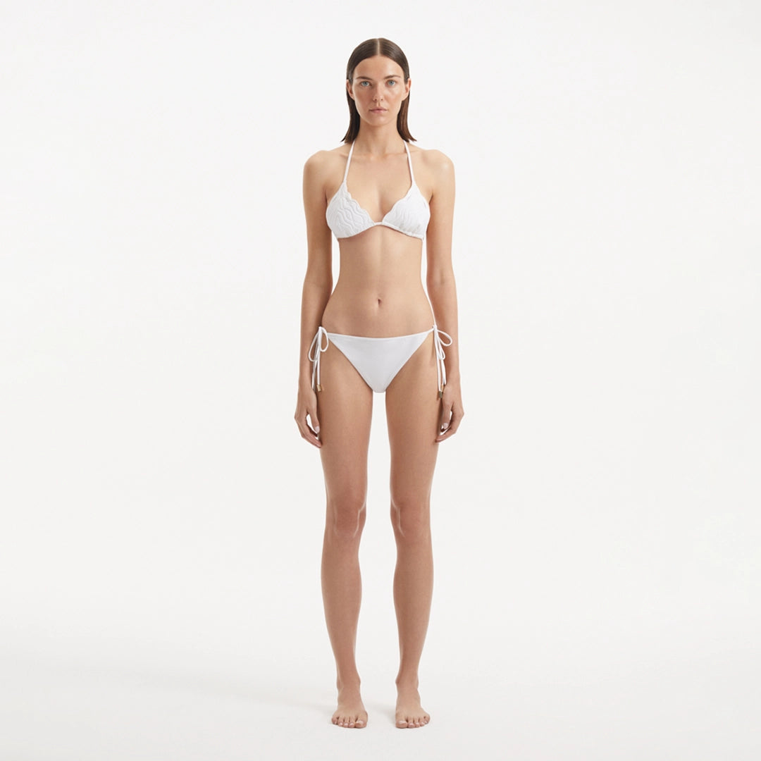 Sarita White Triangle Wave Textured Side Tie Bikini Set | Moeva | | Each week unveils new pieces—luxury swimwear, fluid resort silhouettes, and elevated summer-to-evening essentials designed to carry you from coastal escapes to city nights.