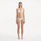 Sarita White Triangle Wave Textured Side Tie Bikini Set | Moeva | | Each week unveils new pieces—luxury swimwear, fluid resort silhouettes, and elevated summer-to-evening essentials designed to carry you from coastal escapes to city nights.