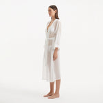 Blaze Long Sleeve Wavy-Trim Belted Sheer White Kaftan | Moeva | Kaftans | Each week unveils new pieces—luxury swimwear, fluid resort silhouettes, and elevated summer-to-evening essentials designed to carry you from coastal escapes to city nights.