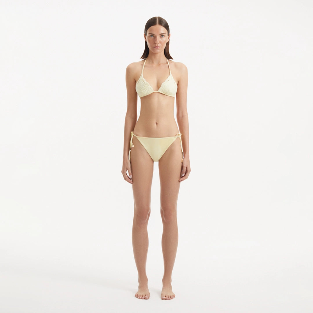 Sarita Yellow Triangle Wave Textured Side Tie Bikini Set | Moeva | | Each week unveils new pieces—luxury swimwear, fluid resort silhouettes, and elevated summer-to-evening essentials designed to carry you from coastal escapes to city nights.