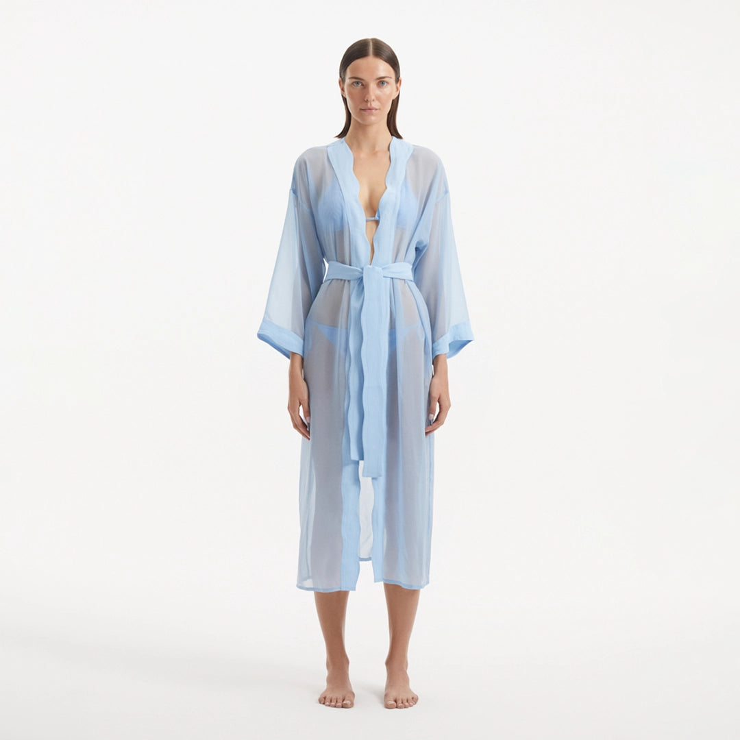 Blaze Long Sleeve Wavy-Trim Belted Sheer Baby Blue Kaftan | Moeva | Kaftans | Each week unveils new pieces—luxury swimwear, fluid resort silhouettes, and elevated summer-to-evening essentials designed to carry you from coastal escapes to city nights.