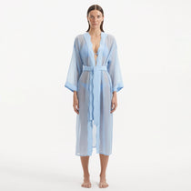 Blaze Long Sleeve Wavy-Trim Belted Sheer Baby Blue Kaftan | Moeva | Kaftan | Each week unveils new pieces—luxury swimwear, fluid resort silhouettes, and elevated summer-to-evening essentials designed to carry you from coastal escapes to city nights.