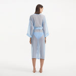 Blaze Long Sleeve Wavy-Trim Belted Sheer Baby Blue Kaftan | Moeva | Kaftans | Each week unveils new pieces—luxury swimwear, fluid resort silhouettes, and elevated summer-to-evening essentials designed to carry you from coastal escapes to city nights.