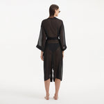 Blaze Long Sleeve Wavy-Trim Belted Sheer Black Kaftan | Moeva | Kaftans | Each week unveils new pieces—luxury swimwear, fluid resort silhouettes, and elevated summer-to-evening essentials designed to carry you from coastal escapes to city nights.