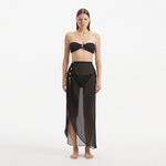 Xander Black Sheer Maxi Skirt with Gold Button Details | Moeva | Beachwear Skirts | Each week unveils new pieces—luxury swimwear, fluid resort silhouettes, and elevated summer-to-evening essentials designed to carry you from coastal escapes to city nights.