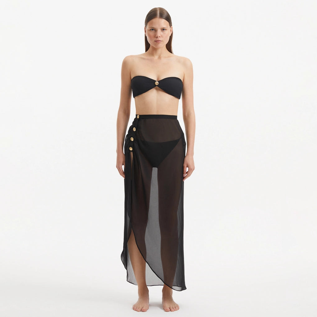 Xander Black Sheer Maxi Skirt with Gold Button Details | Moeva | Skirt | Each week unveils new pieces—luxury swimwear, fluid resort silhouettes, and elevated summer-to-evening essentials designed to carry you from coastal escapes to city nights.