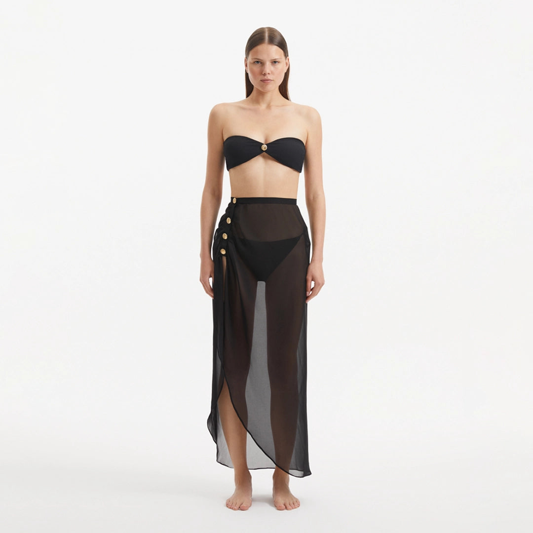 Xander Black Sheer Maxi Skirt with Gold Button Details | Moeva | Beachwear Skirts | Each week unveils new pieces—luxury swimwear, fluid resort silhouettes, and elevated summer-to-evening essentials designed to carry you from coastal escapes to city nights.