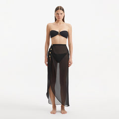 Xander Black Sheer Maxi Skirt with Gold Button Details | Moeva | Beachwear Skirts | Each week unveils new pieces—luxury swimwear, fluid resort silhouettes, and elevated summer-to-evening essentials designed to carry you from coastal escapes to city nights.