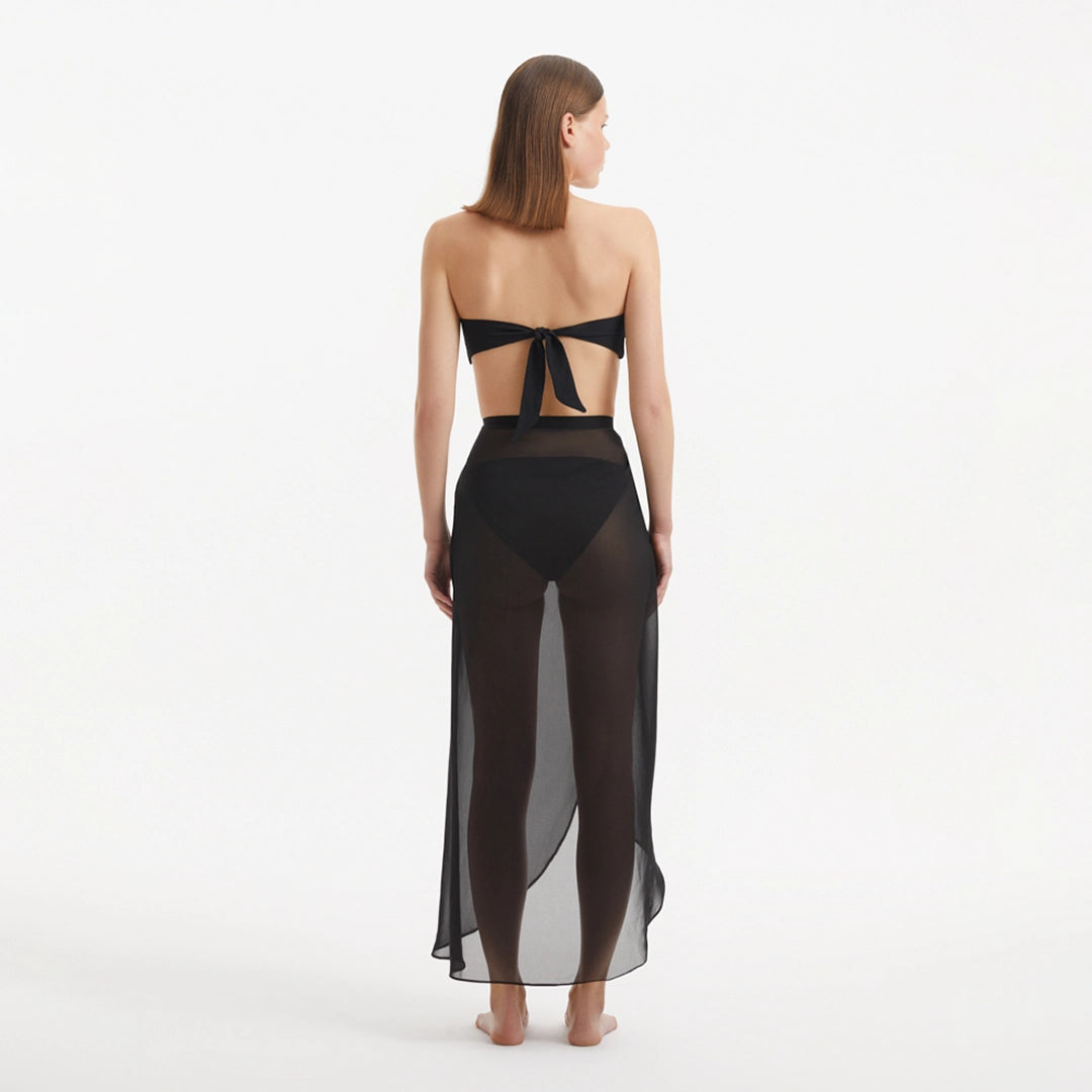 Xander Black Sheer Maxi Skirt with Gold Button Details | Moeva | Beachwear Skirts | Each week unveils new pieces—luxury swimwear, fluid resort silhouettes, and elevated summer-to-evening essentials designed to carry you from coastal escapes to city nights.