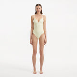 Anahita Yellow V Neck Swimsuit | Moeva | Swimsuit | Each week unveils new pieces—luxury swimwear, fluid resort silhouettes, and elevated summer-to-evening essentials designed to carry you from coastal escapes to city nights.