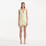 Antonia Yellow High-Waist Wrap Mini Skirt | Moeva | Beachwear Skirts | Each week unveils new pieces—luxury swimwear, fluid resort silhouettes, and elevated summer-to-evening essentials designed to carry you from coastal escapes to city nights.