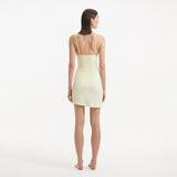 Antonia Yellow High-Waist Wrap Mini Skirt | Moeva | Beachwear Skirts | Each week unveils new pieces—luxury swimwear, fluid resort silhouettes, and elevated summer-to-evening essentials designed to carry you from coastal escapes to city nights.