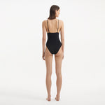Anahita Black V Neck Swimsuit | Moeva | Swimsuit | Each week unveils new pieces—luxury swimwear, fluid resort silhouettes, and elevated summer-to-evening essentials designed to carry you from coastal escapes to city nights.