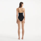 Anahita Black V Neck Swimsuit | Moeva | Swimsuit | Each week unveils new pieces—luxury swimwear, fluid resort silhouettes, and elevated summer-to-evening essentials designed to carry you from coastal escapes to city nights.