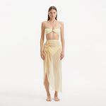 Xander Yellow Sheer Maxi Skirt with Gold Button Details | Moeva | Beachwear Skirts | Each week unveils new pieces—luxury swimwear, fluid resort silhouettes, and elevated summer-to-evening essentials designed to carry you from coastal escapes to city nights.