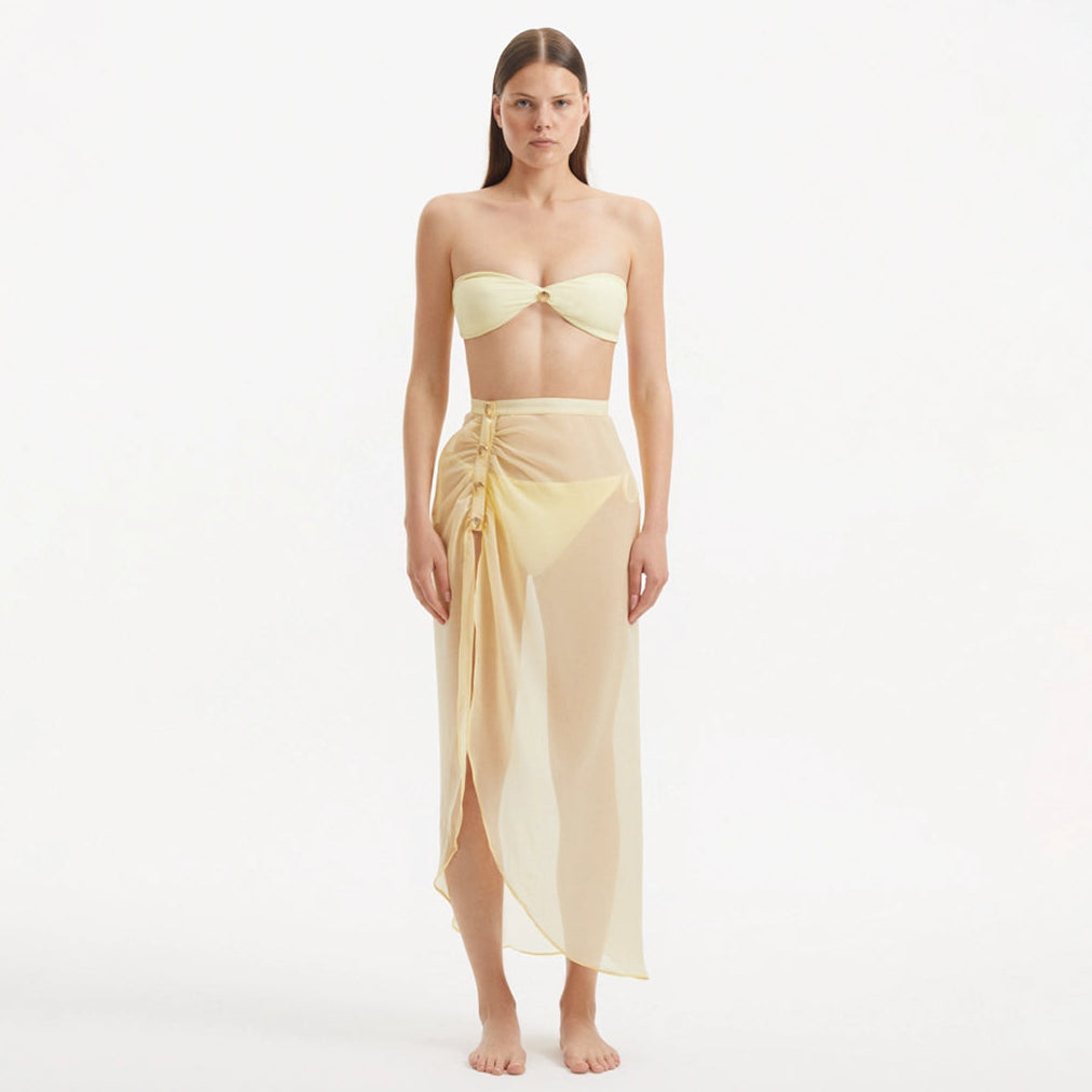 Xander Yellow Sheer Maxi Skirt with Gold Button Details | Moeva | Skirt | Each week unveils new pieces—luxury swimwear, fluid resort silhouettes, and elevated summer-to-evening essentials designed to carry you from coastal escapes to city nights.
