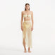 Xander Yellow Sheer Maxi Skirt with Gold Button Details | Moeva | Beachwear Skirts | Each week unveils new pieces—luxury swimwear, fluid resort silhouettes, and elevated summer-to-evening essentials designed to carry you from coastal escapes to city nights.