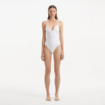 Anahita White V Neck Swimsuit | Moeva | Swimsuit | Each week unveils new pieces—luxury swimwear, fluid resort silhouettes, and elevated summer-to-evening essentials designed to carry you from coastal escapes to city nights.