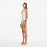 Anahita White V Neck Swimsuit | Moeva | Swimsuit | Each week unveils new pieces—luxury swimwear, fluid resort silhouettes, and elevated summer-to-evening essentials designed to carry you from coastal escapes to city nights.