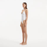 Anahita White V Neck Swimsuit | Moeva | Swimsuit | Each week unveils new pieces—luxury swimwear, fluid resort silhouettes, and elevated summer-to-evening essentials designed to carry you from coastal escapes to city nights.
