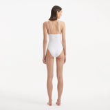 Anahita White V Neck Swimsuit | Moeva | Swimsuit | Each week unveils new pieces—luxury swimwear, fluid resort silhouettes, and elevated summer-to-evening essentials designed to carry you from coastal escapes to city nights.