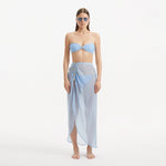 Xander Baby Blue Sheer Maxi Skirt with Gold Button Details | Moeva | Beachwear Skirts | Each week unveils new pieces—luxury swimwear, fluid resort silhouettes, and elevated summer-to-evening essentials designed to carry you from coastal escapes to city nights.