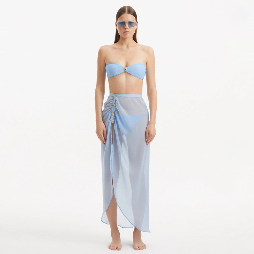 Xander Baby Blue Sheer Maxi Skirt with Gold Button Details | Moeva | Skirt | Each week unveils new pieces—luxury swimwear, fluid resort silhouettes, and elevated summer-to-evening essentials designed to carry you from coastal escapes to city nights.