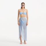 Xander Baby Blue Sheer Maxi Skirt with Gold Button Details | Moeva | Beachwear Skirts | Each week unveils new pieces—luxury swimwear, fluid resort silhouettes, and elevated summer-to-evening essentials designed to carry you from coastal escapes to city nights.