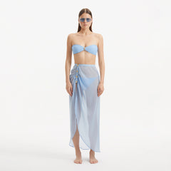 Xander Baby Blue Sheer Maxi Skirt with Gold Button Details | Moeva | Beachwear Skirts | Each week unveils new pieces—luxury swimwear, fluid resort silhouettes, and elevated summer-to-evening essentials designed to carry you from coastal escapes to city nights.