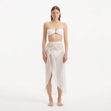 Xander White Sheer Maxi Skirt with Gold Button Details | Moeva | Beachwear Skirts | Each week unveils new pieces—luxury swimwear, fluid resort silhouettes, and elevated summer-to-evening essentials designed to carry you from coastal escapes to city nights.