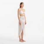 Xander White Sheer Maxi Skirt with Gold Button Details | Moeva | Beachwear Skirts | Each week unveils new pieces—luxury swimwear, fluid resort silhouettes, and elevated summer-to-evening essentials designed to carry you from coastal escapes to city nights.