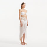 Xander White Sheer Maxi Skirt with Gold Button Details | Moeva | Beachwear Skirts | Each week unveils new pieces—luxury swimwear, fluid resort silhouettes, and elevated summer-to-evening essentials designed to carry you from coastal escapes to city nights.