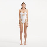 Darya White Scoop Neck Swimsuit | Moeva | Swimsuit | Each week unveils new pieces—luxury swimwear, fluid resort silhouettes, and elevated summer-to-evening essentials designed to carry you from coastal escapes to city nights.