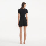 Derin Black Short-Sleeve Mini Dress | Moeva | RTW Dresses | Each week unveils new pieces—luxury swimwear, fluid resort silhouettes, and elevated summer-to-evening essentials designed to carry you from coastal escapes to city nights.