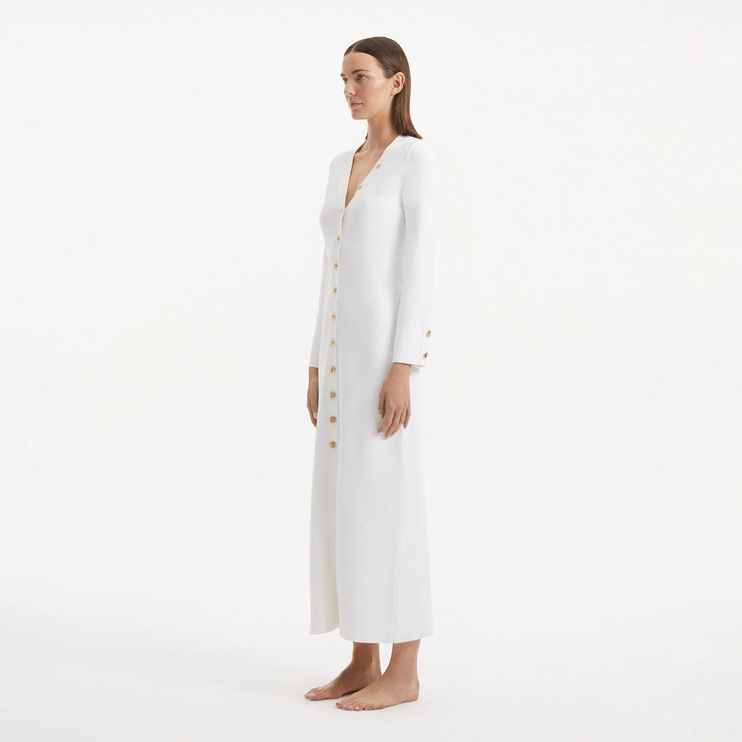 Nira White Dress | Moeva | RTW Dresses | Each week unveils new pieces—luxury swimwear, fluid resort silhouettes, and elevated summer-to-evening essentials designed to carry you from coastal escapes to city nights.