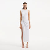 Apollo White Satin Sleeveless Long Dress with Side Slit | Moeva | RTW Dresses | Each week unveils new pieces—luxury swimwear, fluid resort silhouettes, and elevated summer-to-evening essentials designed to carry you from coastal escapes to city nights.