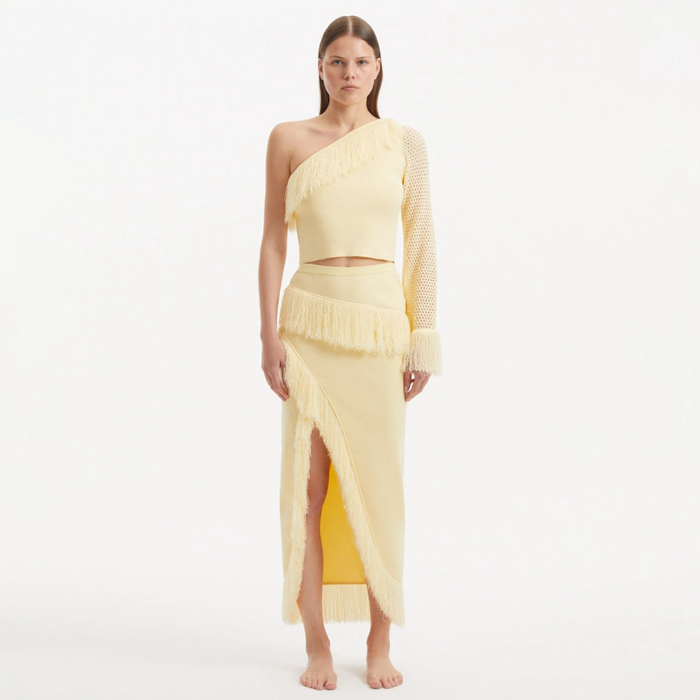 Alani Yellow Fringe Detail Asymmetric Slit Midi Skirt | Moeva | Skirt | Each week unveils new pieces—luxury swimwear, fluid resort silhouettes, and elevated summer-to-evening essentials designed to carry you from coastal escapes to city nights.