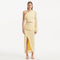 Alani Yellow Fringe Detail Asymmetric Slit Midi Skirt | Moeva | Skirt | Each week unveils new pieces—luxury swimwear, fluid resort silhouettes, and elevated summer-to-evening essentials designed to carry you from coastal escapes to city nights.