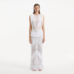 Maris White Knitted Maxi Dress with Fringe and Open Back | Moeva | RTW Dresses | Each week unveils new pieces—luxury swimwear, fluid resort silhouettes, and elevated summer-to-evening essentials designed to carry you from coastal escapes to city nights.