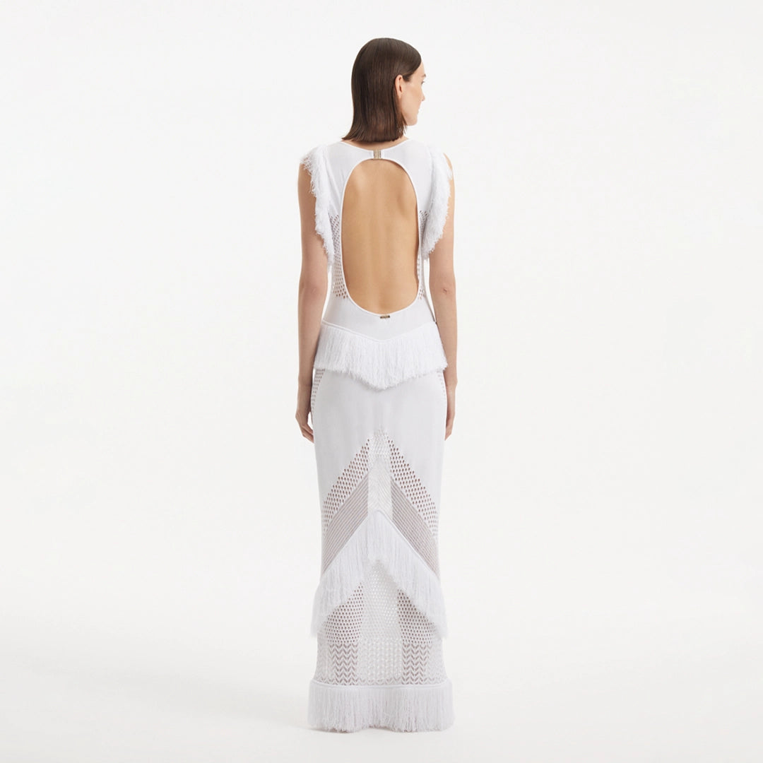 Maris White Knitted Maxi Dress with Fringe and Open Back | Moeva | RTW Dresses | Each week unveils new pieces—luxury swimwear, fluid resort silhouettes, and elevated summer-to-evening essentials designed to carry you from coastal escapes to city nights.