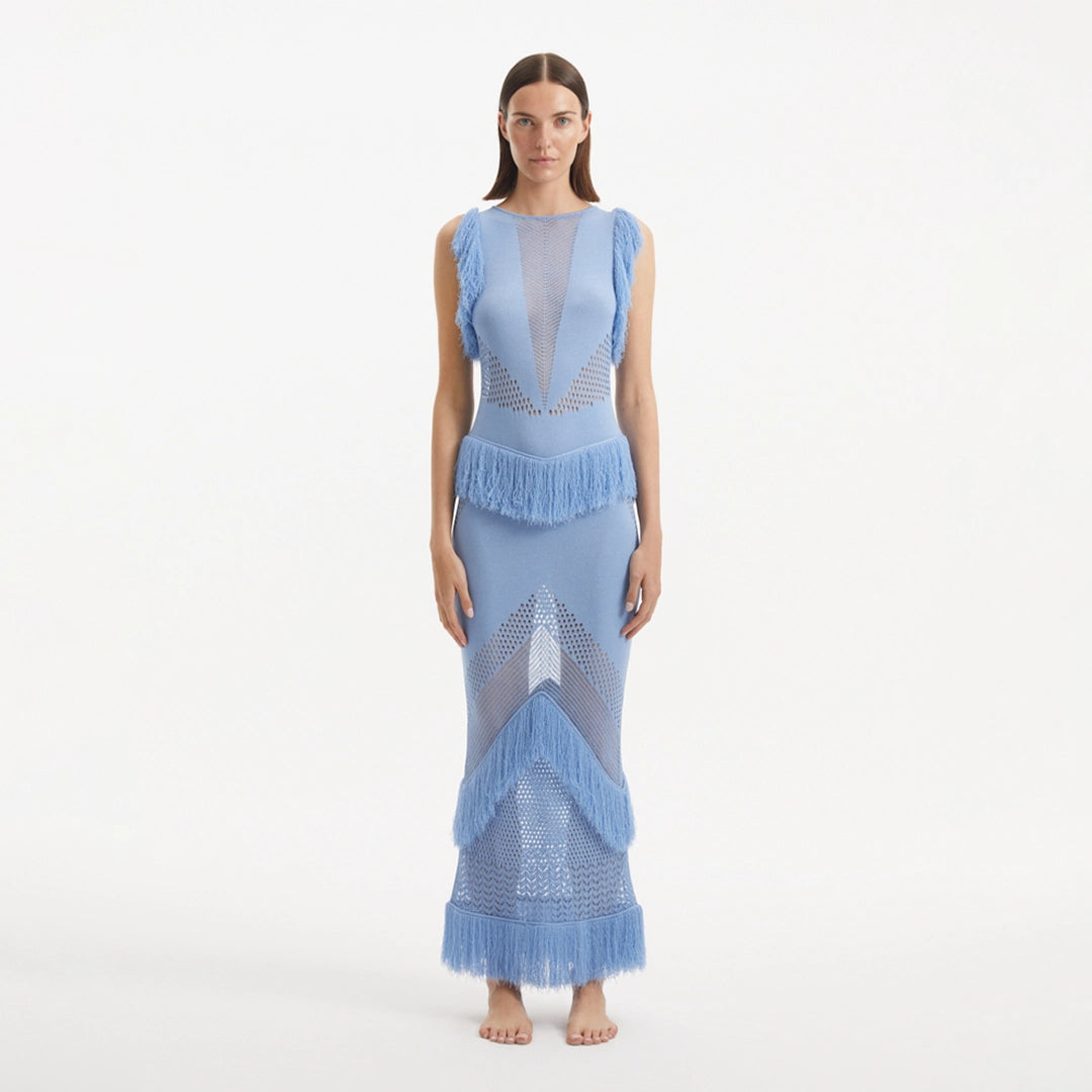 Maris Baby Blue Knitted Maxi Dress with Fringe and Open Back | Moeva | RTW Dresses | Each week unveils new pieces—luxury swimwear, fluid resort silhouettes, and elevated summer-to-evening essentials designed to carry you from coastal escapes to city nights.