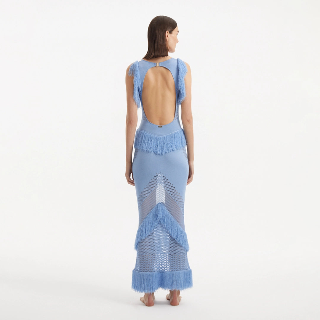 Maris Baby Blue Knitted Maxi Dress with Fringe and Open Back | Moeva | RTW Dresses | Each week unveils new pieces—luxury swimwear, fluid resort silhouettes, and elevated summer-to-evening essentials designed to carry you from coastal escapes to city nights.