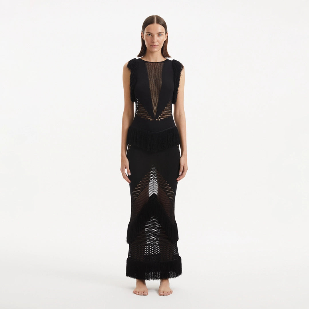 Maris Black Knitted Maxi Dress with Fringe and Open Back | Moeva | RTW Dresses | Each week unveils new pieces—luxury swimwear, fluid resort silhouettes, and elevated summer-to-evening essentials designed to carry you from coastal escapes to city nights.