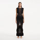 Maris Black Knitted Maxi Dress with Fringe and Open Back | Moeva | RTW Dresses | Each week unveils new pieces—luxury swimwear, fluid resort silhouettes, and elevated summer-to-evening essentials designed to carry you from coastal escapes to city nights.