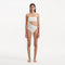 Marilla White Bandeau Satin Swimsuit | Moeva | Swimsuit | Each week unveils new pieces—luxury swimwear, fluid resort silhouettes, and elevated summer-to-evening essentials designed to carry you from coastal escapes to city nights.
