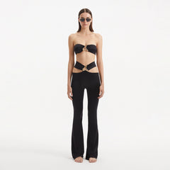 Jenna Black Pants | Moeva | Women Beachwear Pants | Each week unveils new pieces—luxury swimwear, fluid resort silhouettes, and elevated summer-to-evening essentials designed to carry you from coastal escapes to city nights.